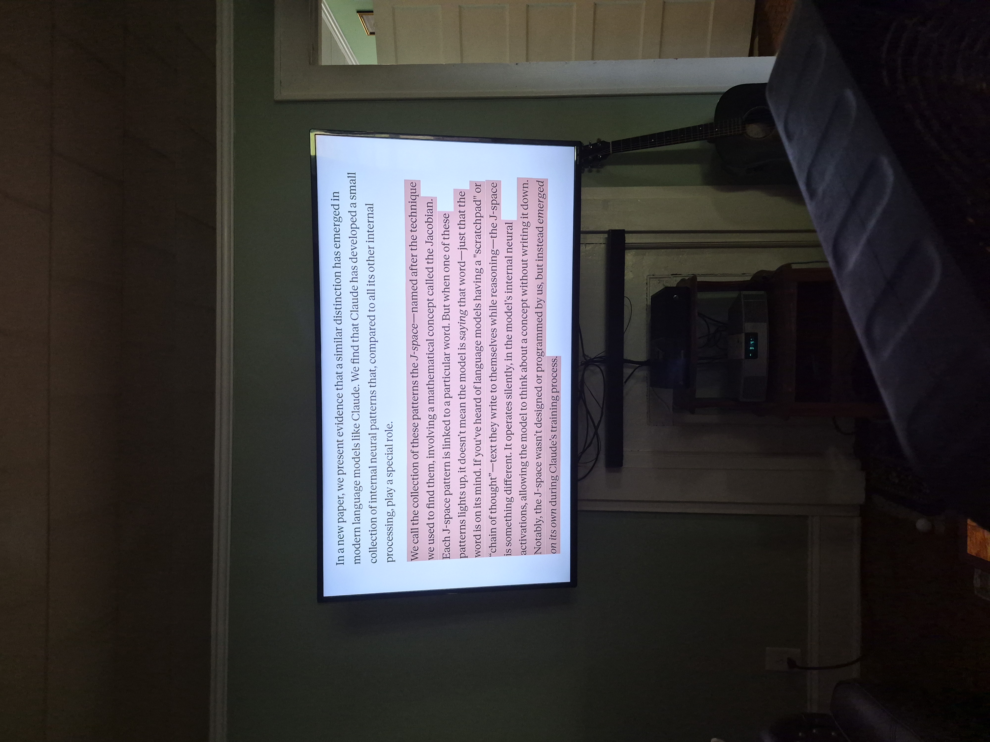 A television showing the continuation of the J-space research, describing patterns that emerged on their own during training, highlighted in pink